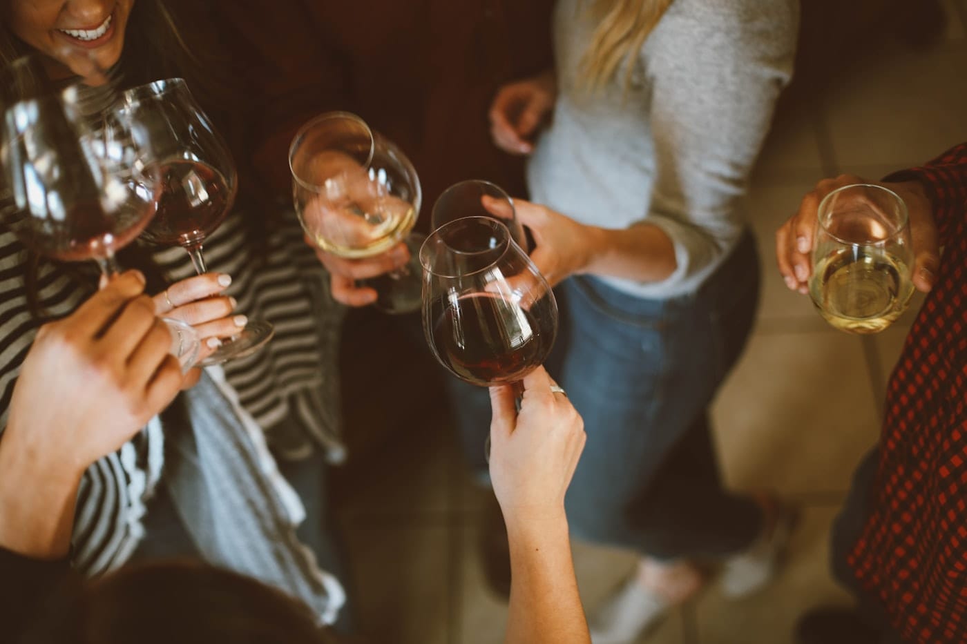 Guests toasting at a private event on the beach